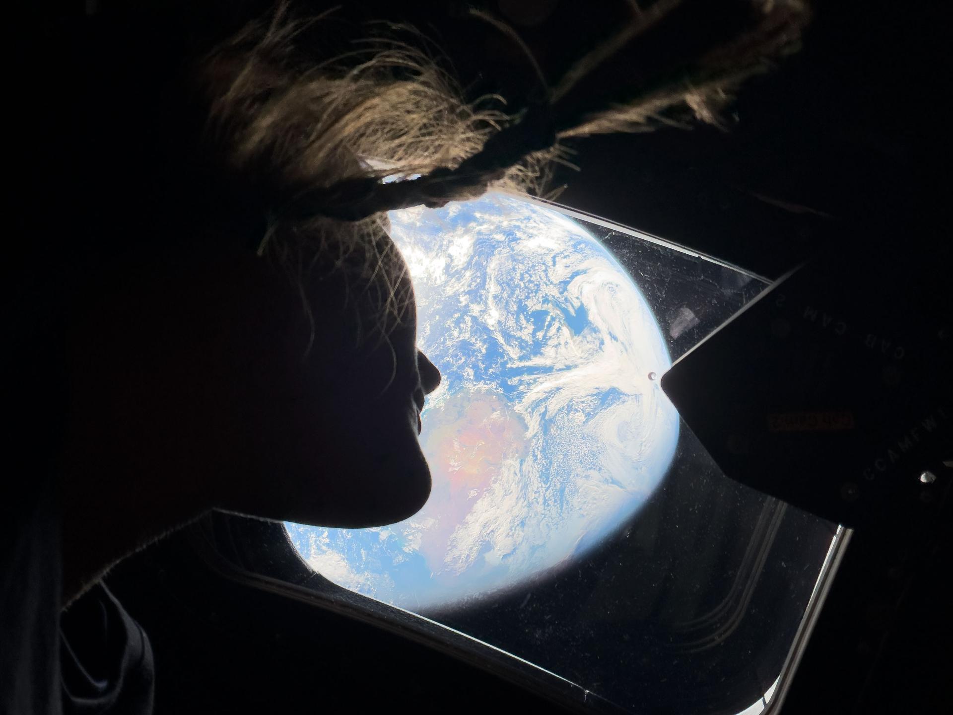 Christina looking at Earth